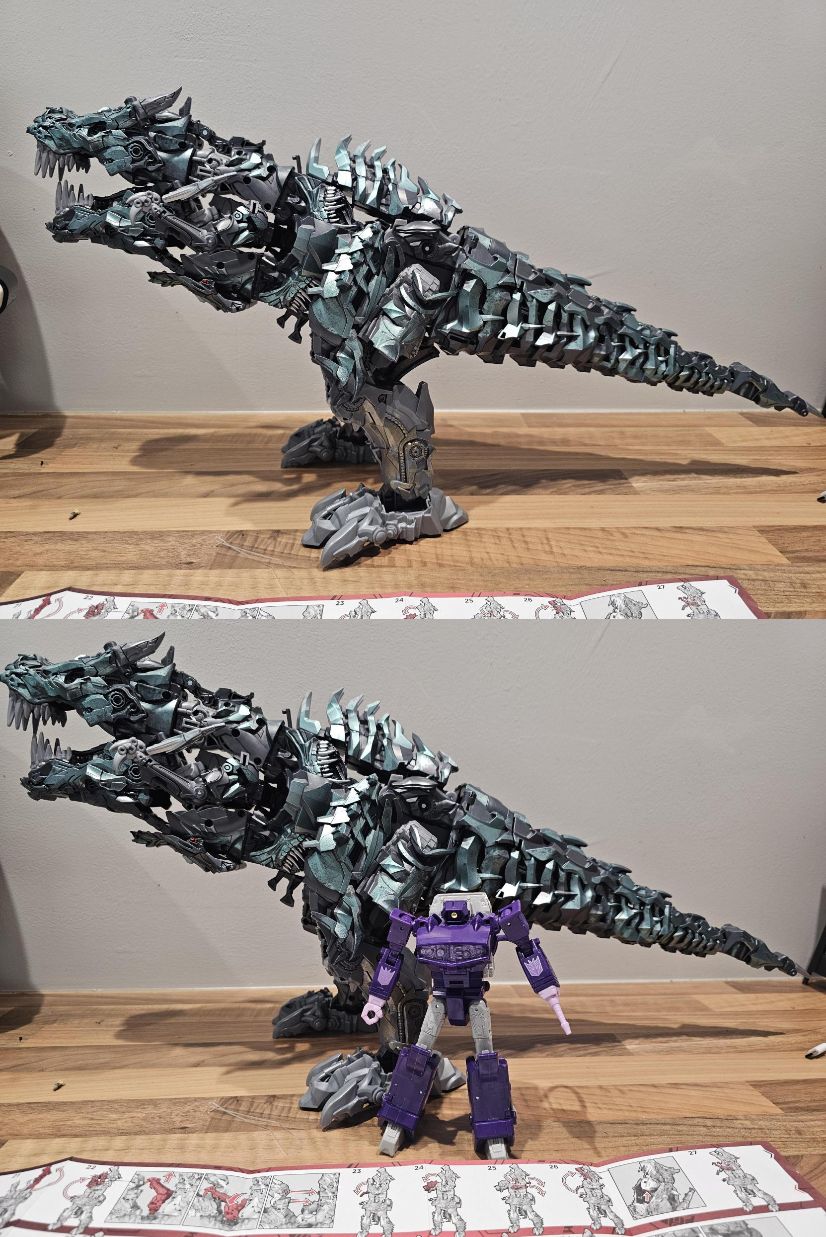 Two pictures within the same image. The picture on top shows a side on snapshot of Grimlock in his dino mode. The second picture below shows a snapshot of Grimlock at the same angle, with a Shockwave figure in front of him to show how big he is.